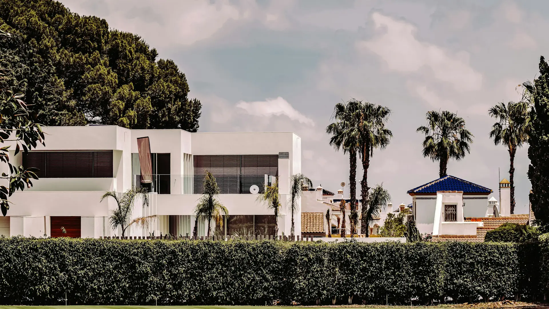 White Mediterranean-style house under a blue sky
