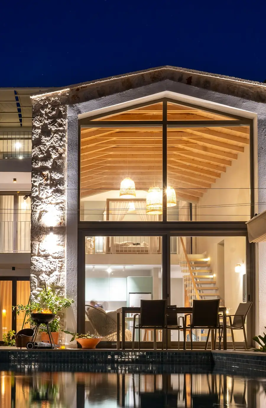 Modern house lit up at dusk